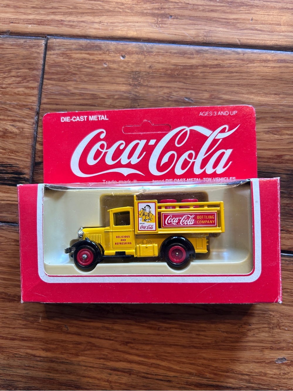 Vintage Coca-Cola die cast metal vehicle. “Delicious and Refreshing”.